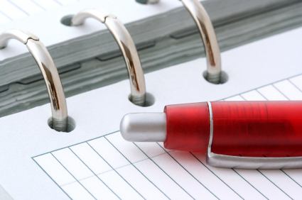 A red pen on a notebook